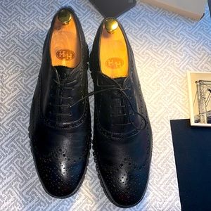 The original all black Cole Haans Zerogrand grand os wingtip Oxford